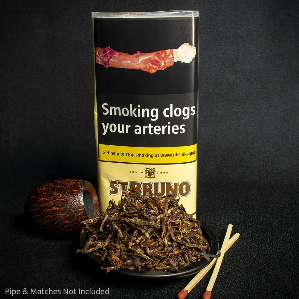 St Bruno Flake Pipe Tobacco 50g – Classic British Blend Available to Buy Online UK If you are searching to buy St Bruno Flake or looking for authentic St Bruno Flake pipe tobacco 50g in the United Kingdom, you have found one of the most enduring and respected pipe tobaccos still available today. St Bruno Flake has been a cornerstone of British pipe smoking for well over a century. Originally created by Ogden’s of Liverpool and now produced to the same high standards by Mac Baren, this St Bruno Flake pipe tobacco continues to deliver the reliable, satisfying smoke that generations of UK pipe smokers have enjoyed. Whether this is your first experience with flake tobacco or you are returning to a long-time favourite, the St Bruno Flake 50g pouch offers everything that makes traditional British pipe tobacco special: quality leaf, careful pressing, a balanced medium strength, and a distinctive yet approachable flavour profile. The Heritage of St Bruno Flake Pipe Tobacco St Bruno began life in Liverpool in the late 19th century under Thomas Ogden. At a time when Liverpool was a major centre of the British tobacco trade, Ogden’s built a reputation for consistent, high-quality blends. St Bruno Flake quickly became one of the best-known pipe tobaccos in the United Kingdom. By the mid-20th century it held a significant share of the UK pipe tobacco market and earned the affectionate status of a national classic. Although production later moved and the brand is now crafted by Mac Baren in Denmark, the essential character of St Bruno Flake has been carefully preserved. The same combination of bright Virginia and dark-fired Kentucky leaf, the same steam-pressing process, and the same subtle citrus and floral notes remain. When UK smokers search for St Bruno Flake tobacco or buy St Bruno Flake online UK, they are looking for this exact traditional experience. What’s Inside the 50g Pouch of St Bruno Flake Every St Bruno Flake 50g pouch contains a carefully balanced blend of Virginia and Kentucky tobaccos. The bright Virginia leaf contributes natural sweetness, grassy notes, and a gentle citrus tang. The dark-fired Kentucky adds body, a mild smoky depth, and a woody character that prevents the blend from becoming one-dimensional. These leaves are blended, then heated and pressed into dense cakes before being sliced into the characteristic thin, dark-brown flakes. The result is the classic appearance that experienced pipe smokers immediately recognise: uniformly shaped flakes with attractive marbling of lighter Virginia against the darker Kentucky background. The light casing (a subtle citrus and floral note often associated with traditional Lakeland-style tobaccos) is applied with restraint. It enhances rather than masks the natural tobacco flavours, giving St Bruno Flake pipe tobacco its signature mild aromatic quality without turning it into a heavily scented blend. How St Bruno Flake Differs from the Ready Rubbed Version Many UK customers also know the Ready Rubbed version of St Bruno. The St Bruno Flake offers a different preparation experience and, according to many long-time smokers, a slightly deeper and more nuanced flavour. Because the tobacco remains in flake form until you prepare it, you control the final consistency. You can: Rub it out finely for a faster burn Leave it coarser for a slower, cooler smoke Fold and stuff the flakes for maximum density and longest burn time This flexibility is one of the main reasons experienced pipe smokers prefer to buy St Bruno Flake rather than the pre-rubbed alternative. The denser flake structure also tends to deliver a longer-lasting bowl when packed properly. Tasting Notes and Smoking Characteristics Strength: Medium Flavouring: Mild (citrus and light floral) Taste: Medium Room Note: Pleasant to tolerable On the light, St Bruno Flake presents a semi-sweet, woody character with a mild citrus sourness that many describe as refreshing. The Virginia sweetness sits comfortably alongside the darker, slightly spicy Kentucky notes. The smoke is cool-burning when sipped slowly, and the blend is known for being relatively clean-burning and leaving less residue than some heavier English mixtures. It is an excellent all-day tobacco for many UK pipe smokers — flavourful enough to remain interesting, yet moderate enough in strength and nicotine to be smoked throughout the day without fatigue. The room note is generally regarded as more acceptable than heavily Latakia-based blends, making it a practical choice for home use. Preparing and Packing St Bruno Flake Flake tobaccos reward a little care in preparation. For best results with St Bruno Flake pipe tobacco 50g: Remove a few flakes from the pouch. Decide on your preferred method — full rub-out, partial rub, or fold-and-stuff. Allow the tobacco a short time to breathe if it feels very moist (though most modern pouches arrive at a good smoking moisture). Pack the bowl lightly to moderately. Flake expands more than ready-rubbed tobacco, so avoid over-packing. Light gently and tamp as needed. The denser nature of the flake often means a longer, more even burn once established. Many smokers find that St Bruno Flake performs especially well in medium-sized bowls and in both briar and cob pipes. Why UK Customers Choose to Buy St Bruno Flake Online In recent years, availability of traditional pipe tobaccos on high-street shelves has declined. More smokers now prefer to buy St Bruno Flake online UK from specialist retailers who offer: Genuine, duty-paid stock Discreet packaging (no external branding that identifies the contents as tobacco) Reliable UK delivery options Clear age-verification processes (18+ only) When you order St Bruno Flake 50g from a reputable UK tobacconist, you receive the authentic product with the correct labelling and health warnings required under UK regulations. Who Will Enjoy St Bruno Flake? This St Bruno Flake pipe tobacco suits a wide range of smokers: Beginners looking for a classic, not-too-strong introduction to flake tobacco Experienced smokers who appreciate traditional British blends Those who enjoy Virginia-Kentucky combinations with only light aromatic influence Pipe smokers seeking a reliable everyday tobacco that is still interesting enough for evening smokes It is less heavily aromatic than many modern flavoured blends and less intense than full English mixtures containing large amounts of Latakia. This middle-ground character is precisely why St Bruno Flake has remained popular for so long in the UK. Summary of Key Features Product: St Bruno Flake Pipe Tobacco 50g Cut: Traditional flake Blend: Virginia and dark-fired Kentucky Flavour profile: Woody, semi-sweet, mild citrus, light floral Strength: Medium Origin of brand: Classic British (originally Ogden’s of Liverpool) Current production: Mac Baren Packaging: 50g pouch Ideal for: Everyday pipe smoking, both new and experienced users Final Thoughts If you are looking to buy St Bruno Flake, St Bruno Flake 50g, or St Bruno Flake pipe tobacco in the United Kingdom, this classic blend remains one of the most dependable and historically significant options available. It offers the satisfaction of a traditional British pipe tobacco with the convenience of modern packaging and online ordering. The combination of quality Virginia and Kentucky leaf, careful flake pressing, mild citrus notes, and medium strength continues to deliver what generations of UK pipe smokers have valued: a cool, flavourful, and consistent smoke. Order your St Bruno Flake pipe tobacco 50g today and experience one of Britain’s most enduring pipe tobacco classics. Discr