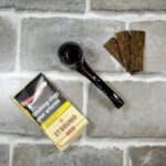 Buy genuine St Bruno Flake pipe tobacco 50g online in the UK. Classic Virginia & Kentucky blend with light citrus notes. Medium strength, cool-burning flake. Discreet packaging & fast UK delivery. 18+ only.