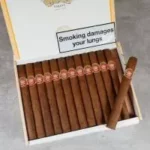 Buy H Upmann Majestic Box 25 cigars online UK. Mild-medium Cuban Crema (5½" x 40) with cedar, cream & nut notes. Genuine handmade Havana. Fast discreet delivery.